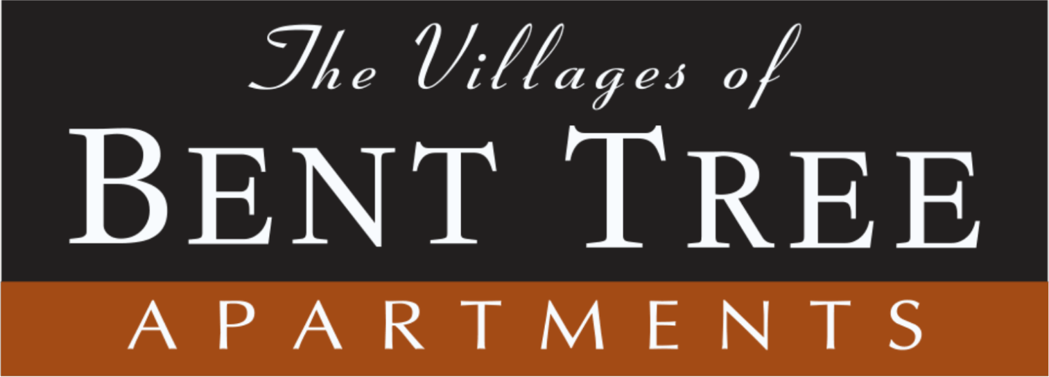 Sign reads "The Villages of Bent Tree Apartments" in white font on a black background, with "APARTMENTS" in white letters on an orange stripe at the bottom.